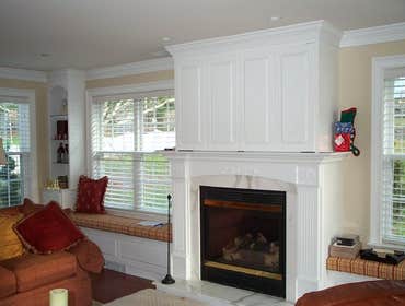 Project photos from Munz Construction, Inc. Custom door into basement media room