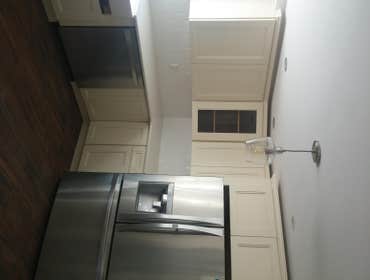Kitchen off white Shaker Removing kitchen and installing new with kitchen with granite back splash and floor tile.