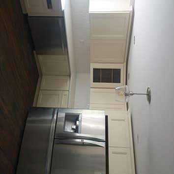 Kitchen off white Shaker Removing kitchen and installing new with kitchen with granite back splash and floor tile.