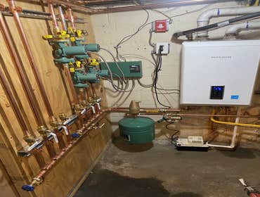 Navien Combi Boiler Install Installation of Navien Combi boiler with new circulator pumps and zone controller.