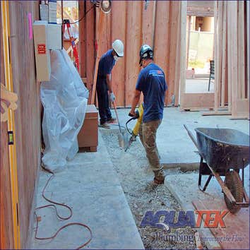 AquaTek employees saw-cutting a slab for a tenant improvement project