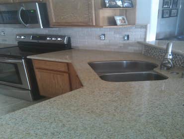 Photo(s) from Excellent Home Improvement New counters, fixtures, and tile flooring.