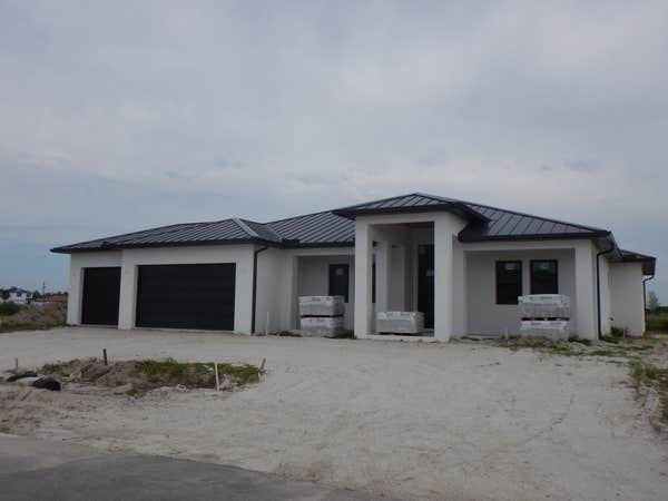Custom Home 4/3 with circular driveway and 3 car garage