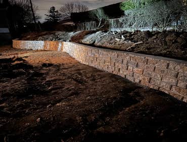 Photos by Lms Construction and Remodeling Retaining Wall Remove existing retaining wall destroyed by fallen tree
Regrade hillside
Regrade lawn
Rebuild 