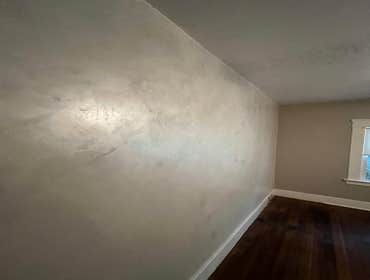 Photos by American Remodels Inc #3 White diamond venetian plaster with an iridescent finish feature wall