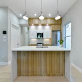 Photos by Urbanity Homes #1 Maverick St Boston MA
The Maverick Street condos are a study in materials. Simple geometries are given interest with contra