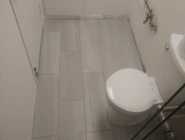 Photos by Duane Serna Tile #22 Bathroom remodel. Walk in shower. 12"×24" porcelain tile with 2"×2" mosaics on shower floor.
