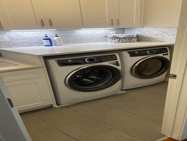 Photos by Infinite Floors & More #6 Laundry room remodel. New cabinets, lighting, flooring, countertop and trim!