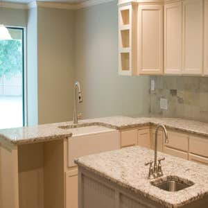 Edmond House Complete gut remodel of 1980's home- updated kitchen (kept original brick floors), updated floor plan, custom built cabinetry, etc.