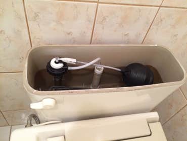 Toilet @Repair Old float fill valve to new fill valve.