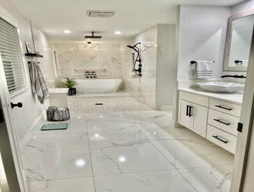 Photos by Lightship Development LLC #1 Complete remodel due to flood. Reconfigured master bathroom floor plan to accommodate over sized walk in shower.