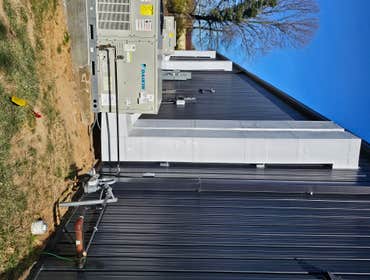 Photos by Kmi HVAC Mechanical INC #1 Commercial building remodel. Three Daikin package units and new round pipe duct work.