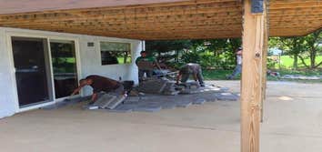 PAVER PATIO AND STONE VENEER PIERS INSTALLATION OF HALF MOON PAVER PATIO WITH STONE VENEER PIERS