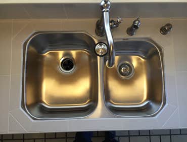 Kithchen Kitchen counter and backsplash with polished porcelain tile and epoxy grout