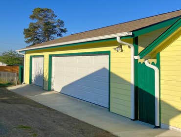 Hardie fiber cement siding, architectural shingles, and weather-resistant trim designed for Pacific Northwest conditions.