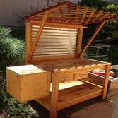 Project photos from Dagan Design & Construction Potting station with two drawers, dirt crate-sifter and a soil bin. Curragated galvinzed steal backdro
