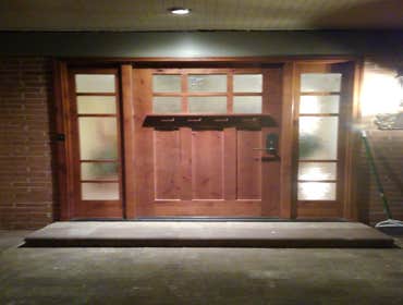 Photos by Cornerstone & Son Construction LLC #4 Installation of solid wood pre-hung door with side lights.