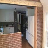 Project photos from DC Construction Services Brick and exterior load bearing wall removal, Steel I beam tied to LVL's to support cathedral ceiling and 
