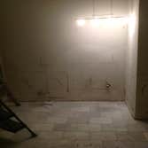 Small bath remodel The color scream on this one turned out great. Carrara marble & porcelain wood plank floor & bench seat. Black Stone vertical center