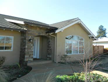 4-coat Stucco in Saratoga with custom Akrotique finish 4-coat stucco on a custom home in Saratoga with a custom Akrotique finish, featuring an Almond f