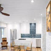 north-dallas-tx-kitchen-remodel_open-concept_white-cabinets_quartz-island_teal-subway-tile-backsplash_