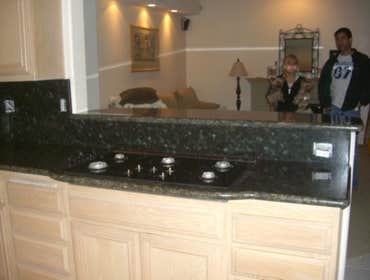 Kitchen Remodeling in H.B. Ca We replaced the Kitchen tiles , also put new granite counter tops and bathroom counter tops.