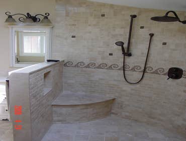 Bathroom Renovation This bathroom is entirely comprised of natural stone on the floor and shower walls. We designed and sold all the products for this 