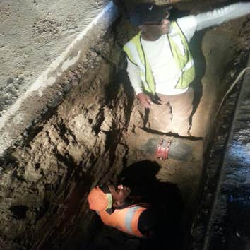 TAPPING MAIN & WATER LINE INSTALLATION Hot Tapping a 10 inch Water Main, Running 300 ft of 2inch water supply with back flow preventer