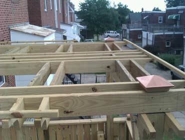 Photo(s) from Laur Moor Construction Two decks and a tiled kitchen floor