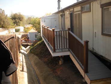 TL Renovations TREX deck The condition of this deck was one of the worst I've come across. We demolished the old rotten deck a build a new TREX compos