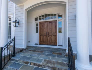 GULICK | CUSTOM Home in McLean The impressive stone and HardiePlank® elevation on our Winthrop really stood out on this corner lot of approximately one