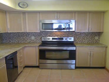 Glass tile backsplash.