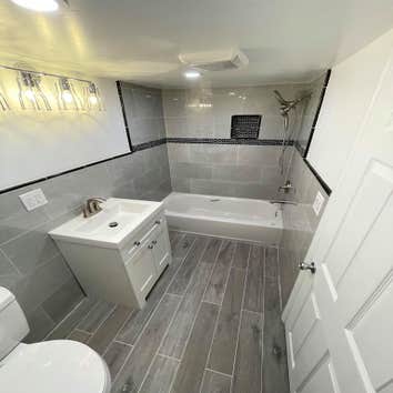 Photos by Hercules Bros LLC #1 Full bathroom addition to basement