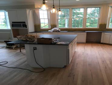 Photos by Top Floor Home Restorations #3 Set cabinets and countertops