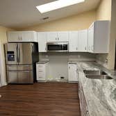 Photos by Tropical Building & Remodeling Inc #1 Completely removed old kitchen and end pony wall. Cut down pony wall to cabinet height and installed ro