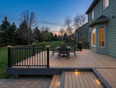 Trex Composite Deck with Black Aluminum Railings and Step Lighting in Rochester