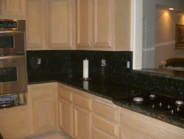 Kitchen Remodeling in H.B. Ca We replaced the Kitchen tiles , also put new granite counter tops and bathroom counter tops.