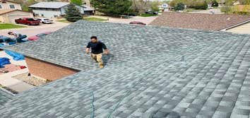 Our crews inspecting a new roof after installation