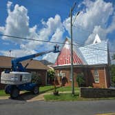 Photos by Muterspaugh Painting Co #1 Restoration of metal roof pressure washing, scraping,sanding. Prime with Sherwin-Williams red oxide primer. Then t