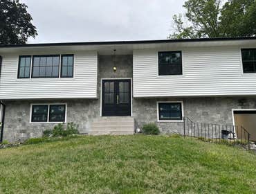 Install vinyl siding, gutters, stone in the front of the house in Edison Nj