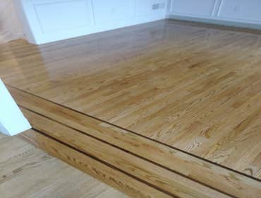 Photos by C&g Hardwood Flooring #2 Installed custom walnut border into existing red oak stained golden oak flooring in two rooms.