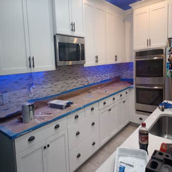 Kitchen cabinet refinish Cabinets went from black to these beautiful cupboards. This project took only a few days and the owner loves it!!