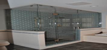 Beautiful Sea Foam Glass Tile with Clear Glass Surround and Pebble Floor