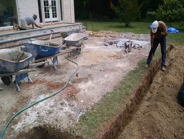 PAVER PATIO, STEPS AND SITTING WALLS GIVE CLIENT A NEW PATIO AND LANDING FOR THE BACK OF HOUSE, AREA FOR GRILLING AND NEW STEPS TO GO TO LOWER PATIO AR
