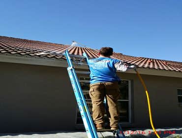Photos from Popa Construction LLC Before & Afters of a soft wash roof cleaning and driveway and side walk cleaning.