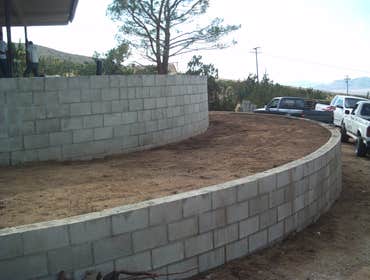 CIRCULAR RETAINING WALLS BEATIFUL DESIGN FOR CIRCULAR RETAINING WALLS FOR NEW LANDSCAPE PLANTING, DESIGNED AND BUILDED BY OUR COMPANY.