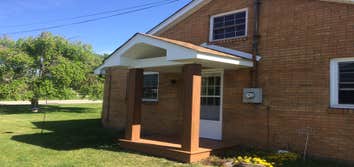 Covered back deck and side porch This beautiful backyard oasis includes a spacious deck which is partially covered by a 12 foot cathedral roof. This 