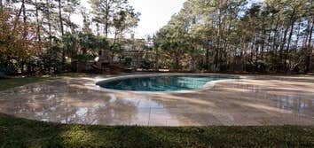 Travertine Pool Deck with custom design Oudoor Fireplace This pool deck and fireplace was a custom design for our client in Charleston, South Carolina.