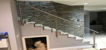 Photos by Brainz & Brawn Structures Inc #1 Stainless Steel bar handrail.. multi-tier stainless railing for interior staircase and basement access.