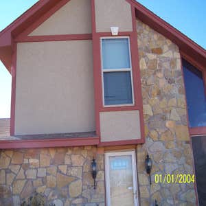 R.U stucco Sandlewood Beige finish on Quarzputz texture and custom mixed Red for the trim.